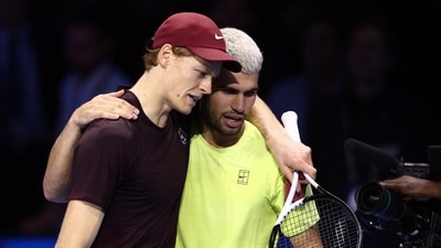 Jannik Sinner and Carlos Alcaraz embrace at the net after the conclusion of their last meeting of 2025. (REUTERS)