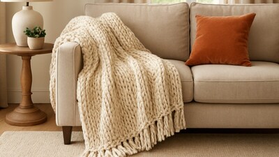 A snug throw placed with ease, bringing warmth, texture and gentle charm to a room that needs a quick seasonal refresh. (Ai Generated) A snug throw placed with ease, bringing warmth, texture and gentle charm to a room that needs a quick seasonal refresh. (Ai Generated)