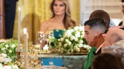 Soccer player Cristiano Ronaldo, right, listens as President Donald Trump speaks during a dinner for Saudi Arabia's Crown Prince Mohammed bin Salman in the East Room of the White House, Tuesday, Nov. 18, 2025, in Washington. (AP Photo/Alex Brandon) (AP)