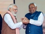 PM Narendra Modi greets JD(U) Chief Nitish Kumar during the swearing-in ceremony, in Patna on Thursday.
