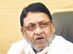 Nawab Malik is facing charges of connivance with Dawood gang members Haseena Parkar, Salim Patel and Sardar Khan and participating in the laundering of illegally usurped property in Kurla years ago. (HT PHOTO)