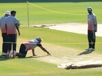 India's crew members inspect pitch during a practice session ahead of the second Test cricket match.