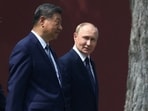 Chinese President Xi Jinping and Russian President Vladimir Putin walk at the personal residence of the Chinese leader Zhongnanhai in Beijing, China September 2, 2025.
