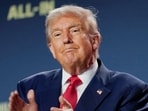President Donald Trump applauds at the "Winning the AI Race" Summit in Washington.