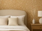 Soft patterned wallpaper brings gentle colour and texture to a calm room that feels refreshed with very little effort.(AI Generated)