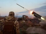 A Ukrainian unit fires a rocket-launch system toward Russian troops in October. , A Ukrainian unit fires a rocket-launch system toward Russian troops in October. ,