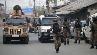Paramilitary soldiers patrol near the Nowgam police station after an accidental explosion on the outskirts of Srinagar. (Photo By Waseem Andrabi /Hindustan Times)
