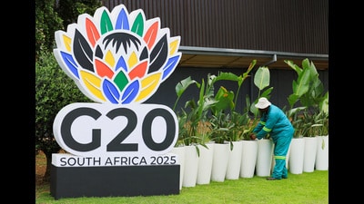 A man works with plants near a G20 sign at the Nasrec Expo centre ahead of the G20 Summit, in Johannesburg in South Africa. (REUTERS) A man works with plants near a G20 sign at the Nasrec Expo centre ahead of the G20 Summit, in Johannesburg in South Africa. (REUTERS)