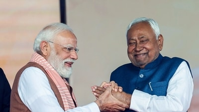 PM Narendra Modi greets JD(U) Chief Nitish Kumar during the swearing-in ceremony, in Patna on Thursday. (DPR PMO) PM Narendra Modi greets JD(U) Chief Nitish Kumar during the swearing-in ceremony, in Patna on Thursday. (DPR PMO)