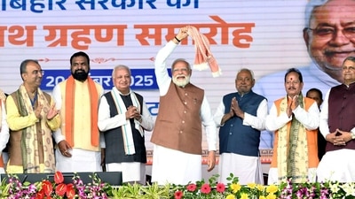 Prime Minister Narendra Modi seen waving his 'gamcha' during the swearing-in ceremony of the NDA government in Patna, Bihar, on Thursday. (@samrat4bjp/X) Prime Minister Narendra Modi seen waving his 'gamcha' during the swearing-in ceremony of the NDA government in Patna, Bihar, on Thursday. (@samrat4bjp/X)