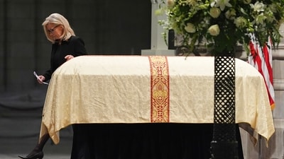 Former Rep. Liz Cheney walks past her fathers casket after speaking a tribute, during the funeral for former Vice President Dick Cheney. (AP) Former Rep. Liz Cheney walks past her fathers casket after speaking a tribute, during the funeral for former Vice President Dick Cheney. (AP)