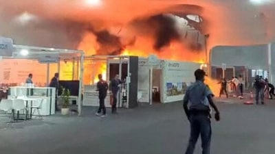 Smoke billowed inside and out of the conference building as firefighters arrived at the scene in Belem. (AFP) Smoke billowed inside and out of the conference building as firefighters arrived at the scene in Belem. (AFP)