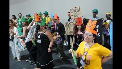 Attendees exit the venue for the COP30 UN Climate Summit, in Belem, Brazil, on Thursday. (AP) Attendees exit the venue for the COP30 UN Climate Summit, in Belem, Brazil, on Thursday. (AP)