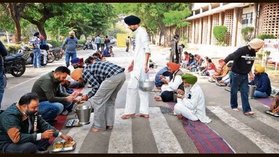 LAYING SIEGE: The Panjab University Bachao Morcha blocking the library road as part of its ongoing agitation on campus on Thursday. (KESHAV SINGH/HT)