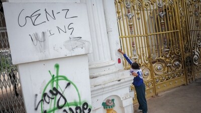 A file photo of a citizen removing graffiti from the main entrance of Singha Durbar office complex that houses the Prime Minister's office and other ministries, following Monday's deadly anti-corruption protests triggered by a social media ban, which was later lifted, in Kathmandu, Nepal September 12, 2025. REUTERS/Adnan Abidi (REUTERS)