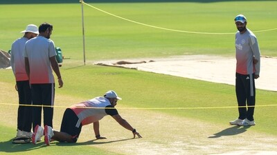 India's crew members inspect pitch during a practice session ahead of the second Test cricket match. (PTI) India's crew members inspect pitch during a practice session ahead of the second Test cricket match. (PTI)