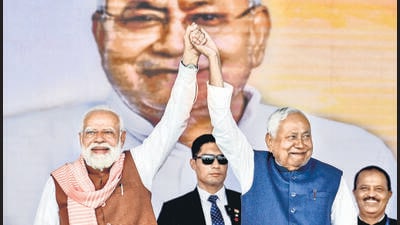 Prime Minister Narendra Modi with Bihar Chief Minister Nitish Kumar after the swearing-in ceremony of the newly formed Bihar government, at Gandhi Maidan, in Patna on Thursday. (PTI) Prime Minister Narendra Modi with Bihar Chief Minister Nitish Kumar after the swearing-in ceremony of the newly formed Bihar government, at Gandhi Maidan, in Patna on Thursday. (PTI)