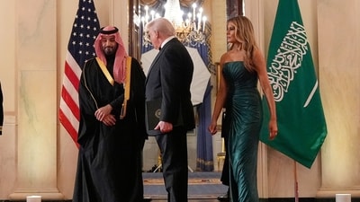 President Donald Trump, first lady Melania Trump and Saudi Arabia's Crown Prince Mohammed bin Salman arrive through the Blue Room for a dinner in the East Room of the White House, Tuesday, Nov. 18, 2025, in Washington. (AP Photo/Alex Brandon) (AP) President Donald Trump, first lady Melania Trump and Saudi Arabia's Crown Prince Mohammed bin Salman arrive through the Blue Room for a dinner in the East Room of the White House, Tuesday, Nov. 18, 2025, in Washington. (AP Photo/Alex Brandon) (AP)