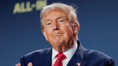 President Donald Trump applauds at the "Winning the AI Race" Summit in Washington. (REUTERS)