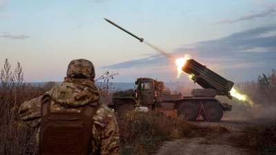 A Ukrainian unit fires a rocket-launch system toward Russian troops in October. , A Ukrainian unit fires a rocket-launch system toward Russian troops in October. ,