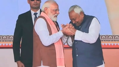 Prime Minister Narendra Modi being greeted by Nitish Kumar after taking oath as the Chief Minister of Bihar during the swearing-in ceremony, at Gandhi Maidan in Patna (PTI) Prime Minister Narendra Modi being greeted by Nitish Kumar after taking oath as the Chief Minister of Bihar during the swearing-in ceremony, at Gandhi Maidan in Patna (PTI)
