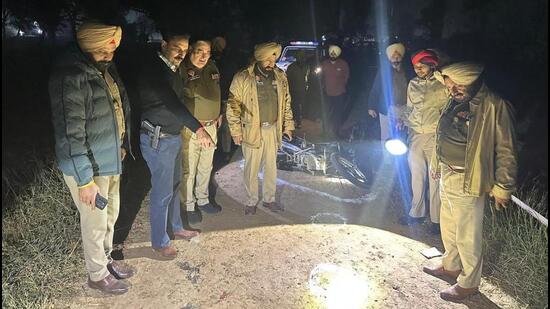 The Punjab Police team at the encounter site in Ferozepur, where Gursimran Singh, the key conspirator of RSS activist Naveen Arora’s murder, was shot on Thursday. (HT Photo)
