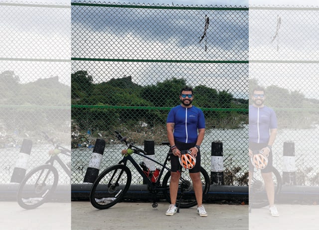 Dipayan Banerjee from Hyderabad cycles late at night along a 23-km solar-roofed track. Dipayan Banerjee from Hyderabad cycles late at night along a 23-km solar-roofed track.