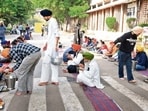 LAYING SIEGE: The Panjab University Bachao Morcha blocking the library road as part of its ongoing agitation on campus on Thursday. (KESHAV SINGH/HT) LAYING SIEGE: The Panjab University Bachao Morcha blocking the library road as part of its ongoing agitation on campus on Thursday. (KESHAV SINGH/HT)