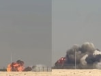 Black smoke rose over the Al Maktoum International Airport at Dubai World Central as spectators looked on. Black smoke rose over the Al Maktoum International Airport at Dubai World Central as spectators looked on.