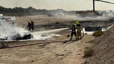 Firefighters work at the site of a crash involving Tejas fighter jet at the Dubai Air Show, United Arab Emirates. (REUTERS)