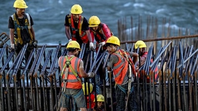 This photograph taken on August 22, 2025 shows labourers working at the under-construction site of the Dibang Multi-purpose Hydroelectric Project on the Dibang river, in the Lower Dibang Valley district of the northeastern state of Arunachal Pradesh. (AFP) This photograph taken on August 22, 2025 shows labourers working at the under-construction site of the Dibang Multi-purpose Hydroelectric Project on the Dibang river, in the Lower Dibang Valley district of the northeastern state of Arunachal Pradesh. (AFP)