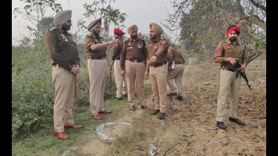 Police at the site of the encounter in Amritsar on Friday. (HT Photo) Police at the site of the encounter in Amritsar on Friday. (HT Photo)