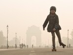 A girl skates at Kartavya Path amid dense smog as the air quality remains poor, in New Delhi on Saturday. A girl skates at Kartavya Path amid dense smog as the air quality remains poor, in New Delhi on Saturday.