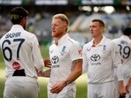 England's captain Ben Stokes, second left, shakes hands with teammate Shoaib Bashir England's captain Ben Stokes, second left, shakes hands with teammate Shoaib Bashir