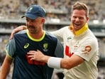 Australia's captain Steve Smith, right, and Travis Head celebrate after winning their first Ashes cricket test match against England in Perth, Saturday