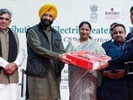 CM Rekha Gupta and minister Manjinder Singh Sirsa distributing the heaters to RWAs on Saturday. (X-Rekha Gupta)