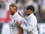 Ben Stokes and Joe Root walk off after Travis Head's match-winning century.