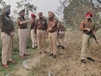 Police at the site of the encounter in Amritsar on Friday. (HT Photo)
