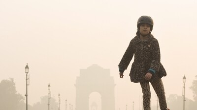 A girl skates at Kartavya Path amid dense smog as the air quality remains poor, in New Delhi on Saturday. (ANI) A girl skates at Kartavya Path amid dense smog as the air quality remains poor, in New Delhi on Saturday. (ANI)