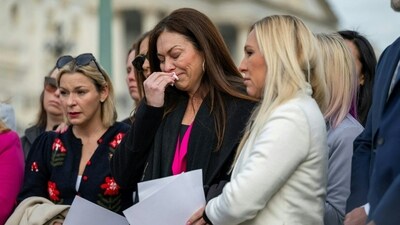 US Representative Marjorie Taylor Greene, Republican of Georgia (R) comforts Haley Robson, a Jeffrey Epstein survivor during a news conference on the "Epstein Files Transparency Act" at the US Capitol in Washington, DC. (AFP) US Representative Marjorie Taylor Greene, Republican of Georgia (R) comforts Haley Robson, a Jeffrey Epstein survivor during a news conference on the "Epstein Files Transparency Act" at the US Capitol in Washington, DC. (AFP)