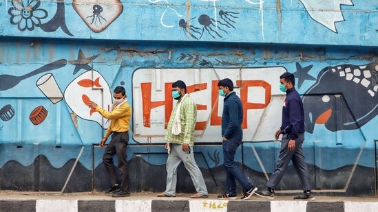 Gram it: People wearing face masks walk past a mural reading 'HELP'. Meanwhile, the Air Quality Index (AQI) in Delhi continues to remain in ‘very poor’ category. This has also led the Directorate of Education (DoE), of the Delhi government, to suspend all outdoor sports activities in schools. (Photo: ANI)