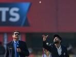 India's captain Rishabh Pant (R) tosses the coin as cricket commentator Ravi Shastri watches before the start of the second Test cricket match between India and South Africa