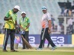 India's batting coach Sitanshu Kotak (R) inspects the pitch between India and South Africa Test match India's batting coach Sitanshu Kotak (R) inspects the pitch between India and South Africa Test match