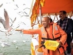 Chief minister Yogi Adityanath feeding seagulls in Prayagraj on Saturday. (ANI) Chief minister Yogi Adityanath feeding seagulls in Prayagraj on Saturday. (ANI)