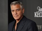 George Clooney arrives at the premiere of 