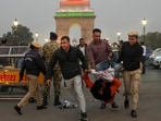 Police and security personnel detain a protestor during a protest against worsening air quality in the national capital, near the India Gate, in New Delhi, Sunday, Nov. 23, 2025. Police and security personnel detain a protestor during a protest against worsening air quality in the national capital, near the India Gate, in New Delhi, Sunday, Nov. 23, 2025.