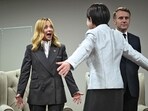 Italy's Prime Minister Giorgia Meloni greets Japan's Prime Minister Sanae Takaichi on the sidelines of a G20 Leaders' Summit plenary session.