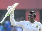 South Africa's Senuran Muthusamy celebrates after scoring a century on Day 2 of the second Test against India. (AFP) South Africa's Senuran Muthusamy celebrates after scoring a century on Day 2 of the second Test against India. (AFP)