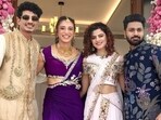 Smriti Mandhana and Palash Muchhal pose during their mehndi ceremony with Palash's sister, Palak Muchhal and Mithoon. 