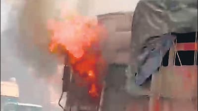 Truck runs over, kills biker; residents set truck ablaze Truck runs over, kills biker; residents set truck ablaze